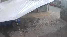 Security camera catches gate flying in windy Puebla