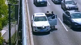 Heroic firefighter and police officer save distressed driver on highway