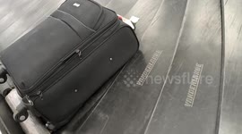 China: Passengers Pick up Suitcases After Getting off A Plane at Xinzheng Airport