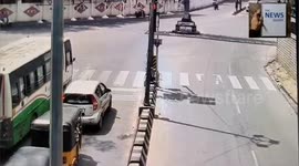 A Speeding car jumps a Red Signal, lost control and flipped over several times after hitting another car in South India