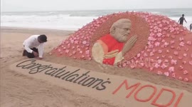 Sand artist creates detailed sculpture on Indian beach to congratulate Modi on election win