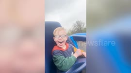 Twins with cerebral palsy laugh uncontrollably on roller coaster ride
