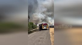 USA: Valiant Firefighters Combat Wildland Blaze Near Houston Avenue and McAuliff Street