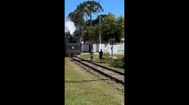 Train conductor hilariously clears path by shoving pedestrian away
