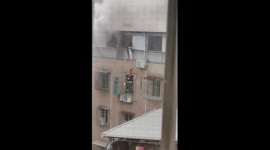 Firefighters rescue two sisters trapped outside window during apartment inferno