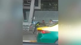 Airport security guards suspended for fighting in front of passengers at Bangkok Airport