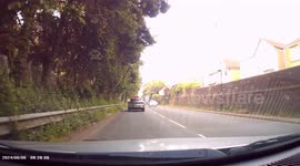 DASHCAM - Dangerous Driving. Maniac in Black Hyundai overtakes on hatched area, and proceeds to drive recklessly.