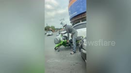 Wild monkey attacks motorcycle rider and steals his durian