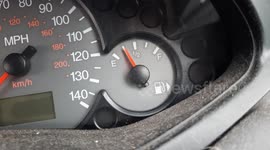 Car fuel gauge seen moving erratically with engine turned off.