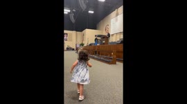 Adorable little girl steals the show while celebrating dad's special moment