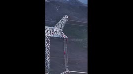 Drones deliver food to electricity workers on 70-meter-high pylons in SW China