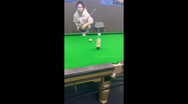Girl makes impressive snooker trick shot with bottle