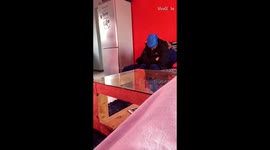 Little boy pretends to spill hot tea on his mom