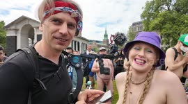 Naturist Lucy Muse talks about World Naked Bike Ride London whilst another rider offers free public pubic shaves