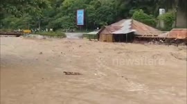 Sudden river overflow in Indonesia damages homes and cafés along riverbank