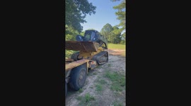 Golden Retriever Gets a Ride in a Skid Steer