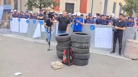 Protesters set fire to tyres outside Tirana city hall in demonstration against mayor