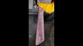 Oiling up the red honeycomb handle of my freshly finished chefs knife.