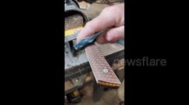Skilled artisan crafts stunning knives with honeycomb and pinecone designs and then slices paper to test sharpness