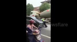 Car attempting to flee drags traffic officer on bonnet along road in China