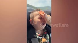Adorable baby laughs when mum dabs makeup puff on his face