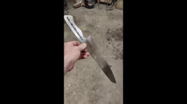 Showing the heel of a handmade kitchen knife made from stainless steel