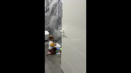 Child sticks face masks to wall tiles in Yalta
