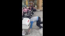 Chinese boys dance to vehicle alarm rhythms on street