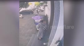 Woman saves herself but sends smoking man flying down steps after her