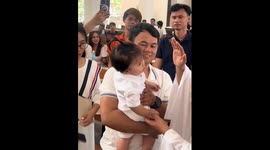 Child engages in adorable chat with priest during baptism in Tanza, Cavite
