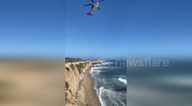 USA: Stranded Kite Surfer Rescued After Spelling 'HELP' with Rocks on California Beach