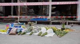 Flowers laid at Bangkok market fire scene where thousands of pets were burned alive