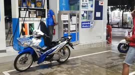 Shocked motorcycle rider finds live SNAKE in the fuel tank