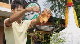 Grilled chicken catapulted through the air and caught by man on unicycle