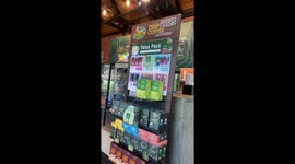 Stray dog relaxes in coffee shop doorway to enjoy air con breeze