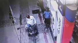 Motorbike bursts into flames as rider picks up his phone