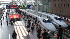 China: Passengers Take A Harmony Bullet Train at Nanjing Railway Station in Nanjing