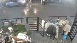 Kind neighbor pushes clothesline to prevent it from being drenched