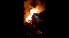 A massive fire destroyed three buildings in the midst of a major flood disaster in Indonesia