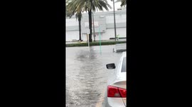 Man Kayaking on Flooded Street