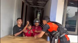 Dozens of mothers and children evacuated as devastating flash floods hit Indonesia