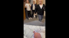 Sisters' hearts swell with love during surprise first meeting with baby brother