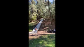 Ramp slide fail: seated descent ends in hilarious tumble