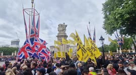 Cheers and jeers as Royals' procession passes through the Mall for Trooping the Colour