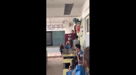 High school students surprise teacher with flowers before exam