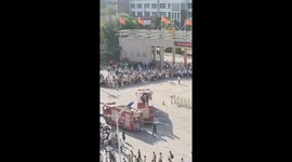Firemen make 'Dragon Gate' water arch for students at entrance exams