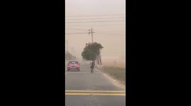 Sandstorm turns sky orange as it sweeps through village in China