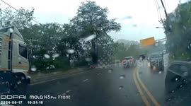 Petrol tanker slides on wet road