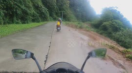 Wet, mossy concrete causes motorcycle slide Accident