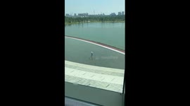 Toddler plays in fountain with her mother amid hot weather in China